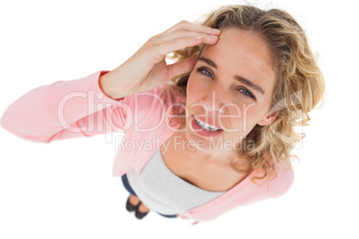 Overhead of attractive woman touching her forehead