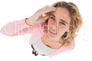 Overhead of attractive woman touching her forehead