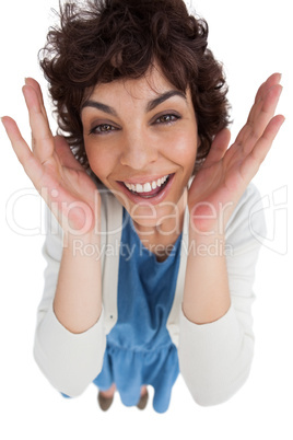 Overhead of amazed woman with hands wide opened