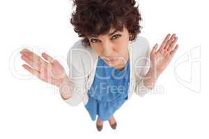 Overhead of a confused  woman gesturing