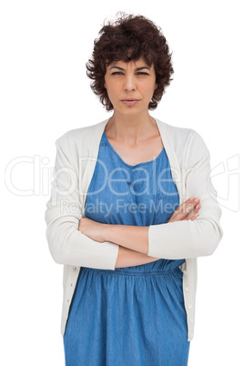 Serious brunette woman with arms folded