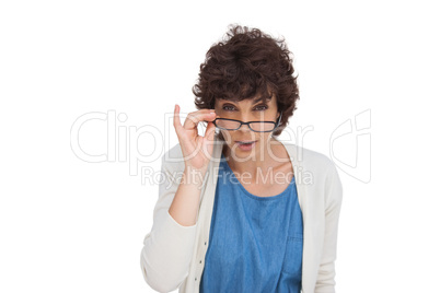 Shocked woman looking over her glasses