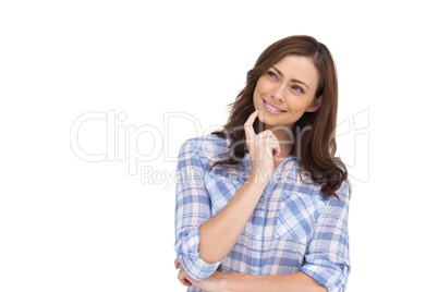 Thoughtful woman placing her finger on her chin