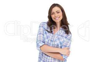 Smiling woman with arms folded