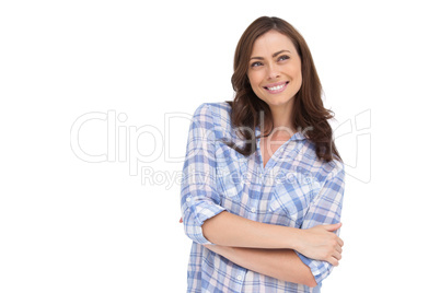 Thoughtful woman with arms folded