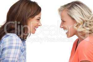 Two friends looking to each other and laughing