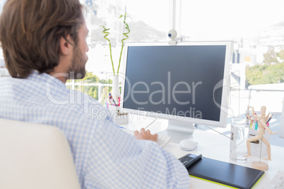 Desinger working on his computer