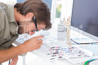 Editor looking at the contact sheet