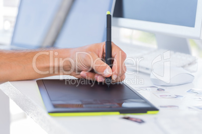 Male hands using graphics tablet