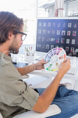 Editor looking at colour wheel