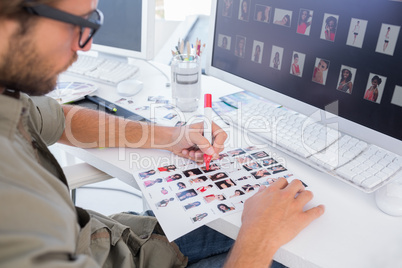 Photo editor marking the contact sheet