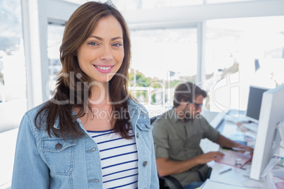Woman smiling in creative office
