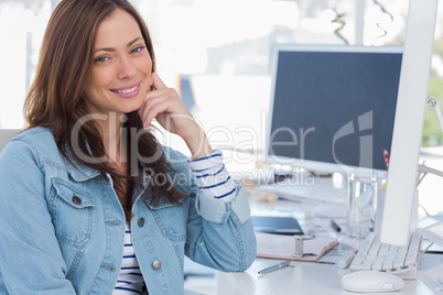 Cheerful designer smiling in creative office