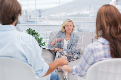 Therapist talking to a couple