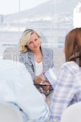 Therapist giving tissue to the wife