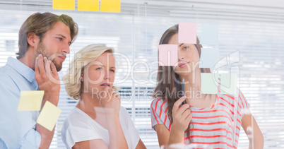 Three colleagues looking thoughtful