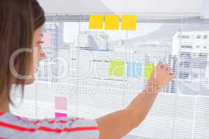 Woman pasting sticky note