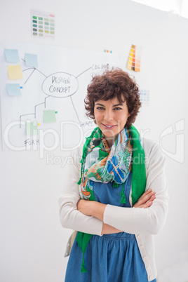 Designer standing with arms crossed