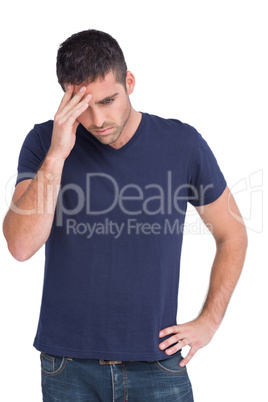 Upset man holding his forehead