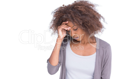 Sad woman holding her forehead with her hand