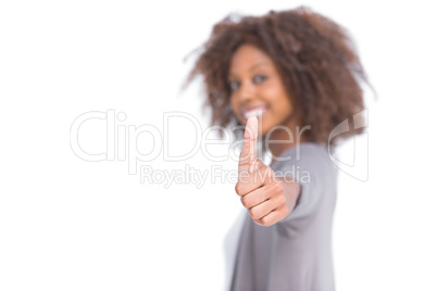 Attractive woman giving her thumb up