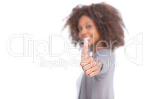 Attractive woman giving her thumb up