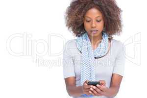 Concentrated woman typing a text message