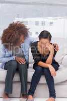 Woman crying next to her therapist