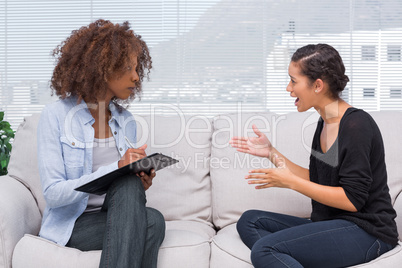 Upset woman speaking to her therapist