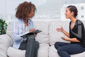 Woman gesturing and speaking to her therapist