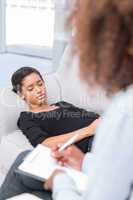 Woman lying on sofa during therapy session