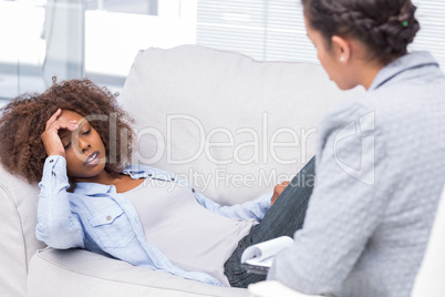 Woman on sofa telling her problems