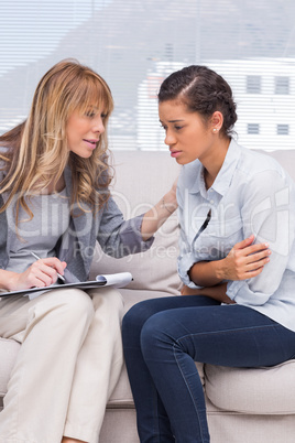 Psychotherapist helping a depressed patient