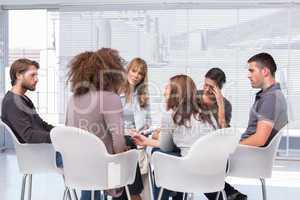 Patients around therapist in group therapy session