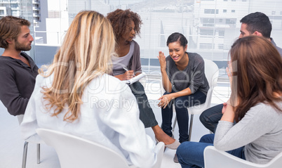 Woman getting depressed in group therapy