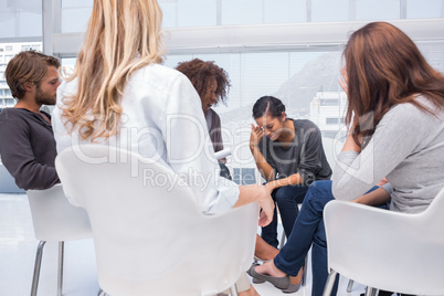 Woman crying at group therapy