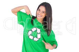 Enivromental activist pointing to the symbol on her tshirt