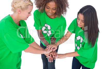 Three enviromental activists putting their hands together