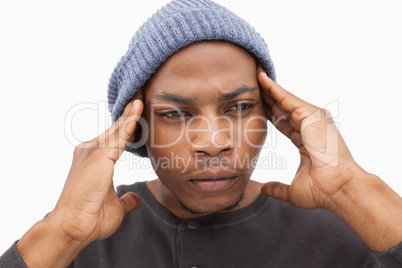 Worried man in beanie hat