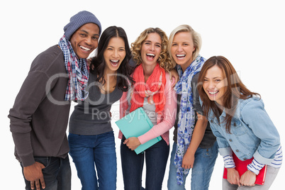 Fashionable students in a row smiling