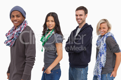 Stylish young people in a row smiling