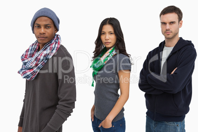 Stylish young people in a row looking serious