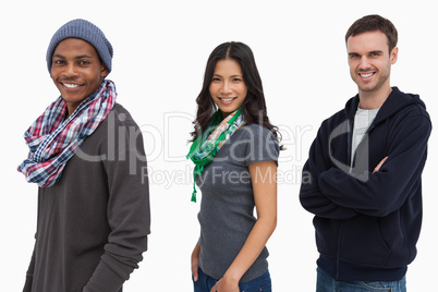 Stylish young people in a row looking happy