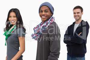 Smiling stylish young people in a row