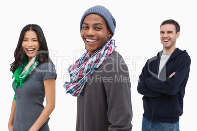 Laughing stylish young people in a row