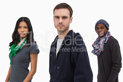 Serious stylish young people in a line