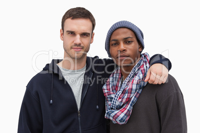Two fashionable friends looking at camera
