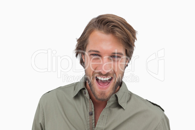 Man laughing at camera