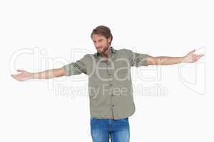 Happy man with arms outstretched