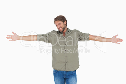 Man standing with arms outstretched